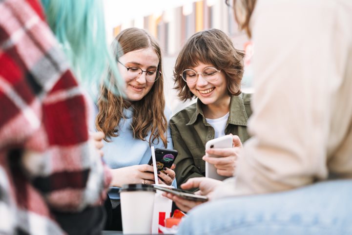 Two friends laughing and talking.
