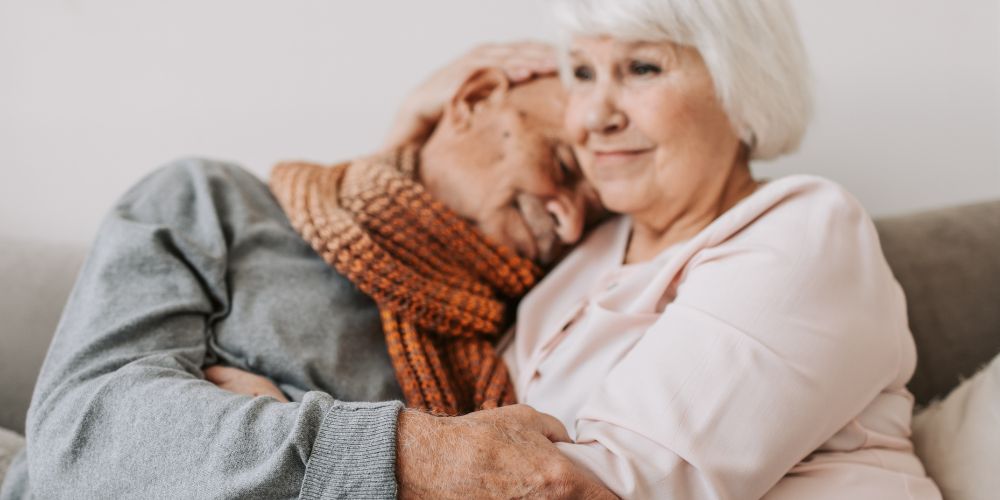 Older couple embracing in hug