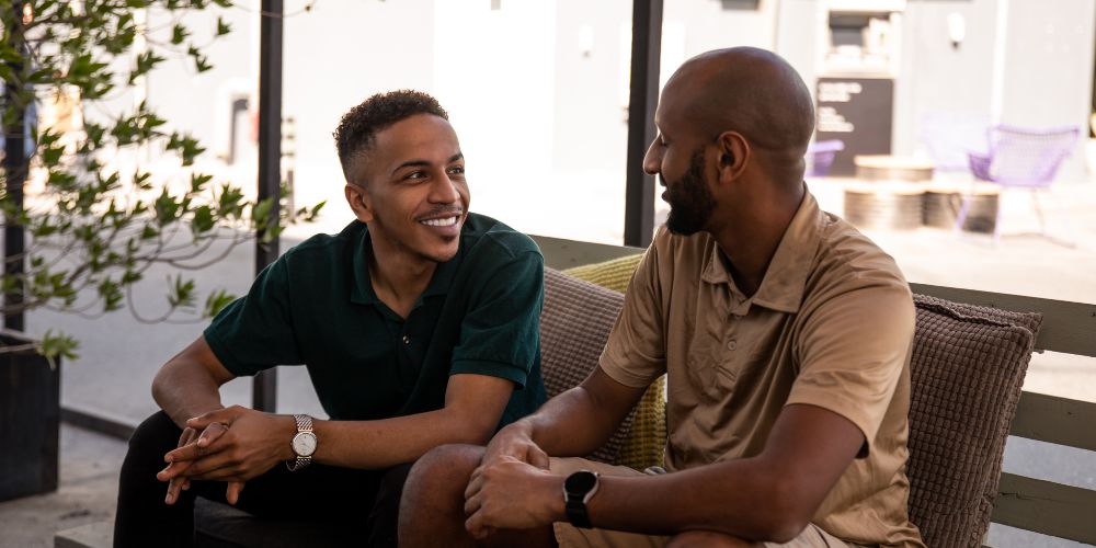 two male friends talking