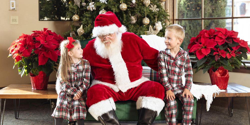 Santa with two young children