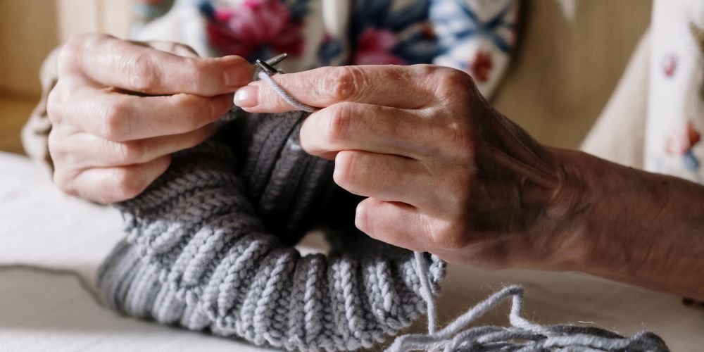 Close up of woman's hands knitting
