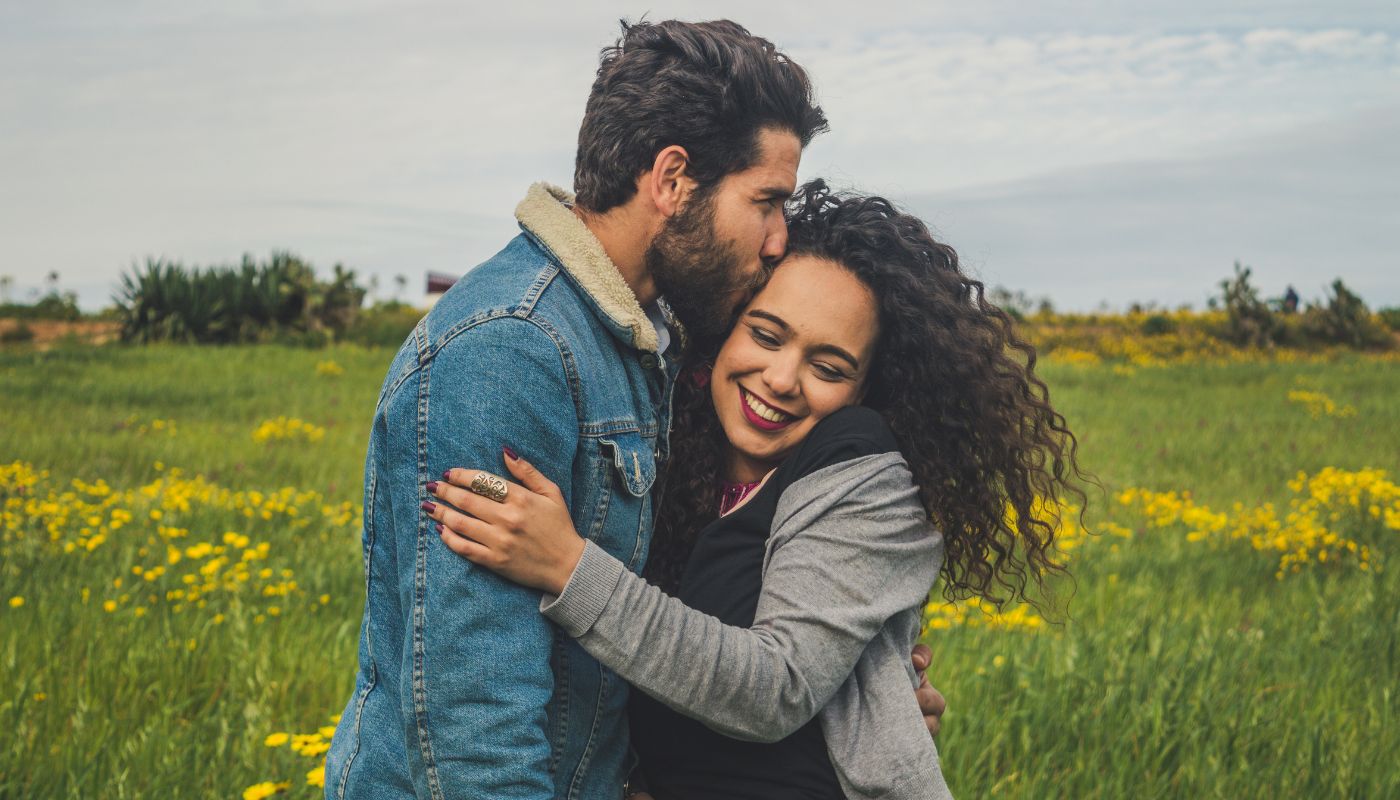 Man and woman embracing each other.