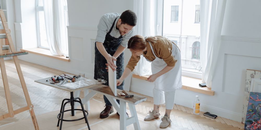 Two people painting