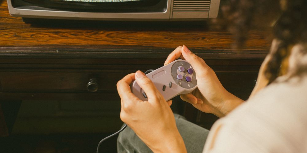 Person playing vintage video game