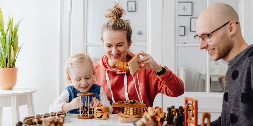 parents playing with their child