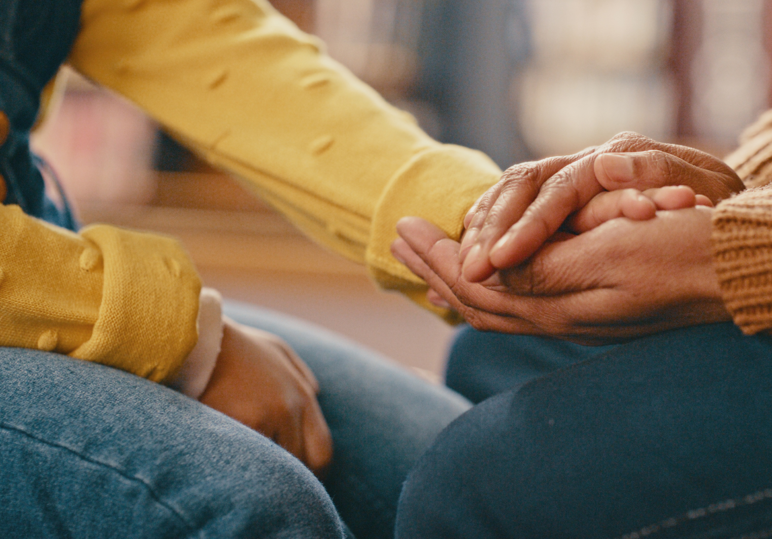 A close up of two hands clasped together