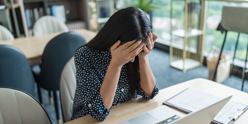 A person looking stressed at work