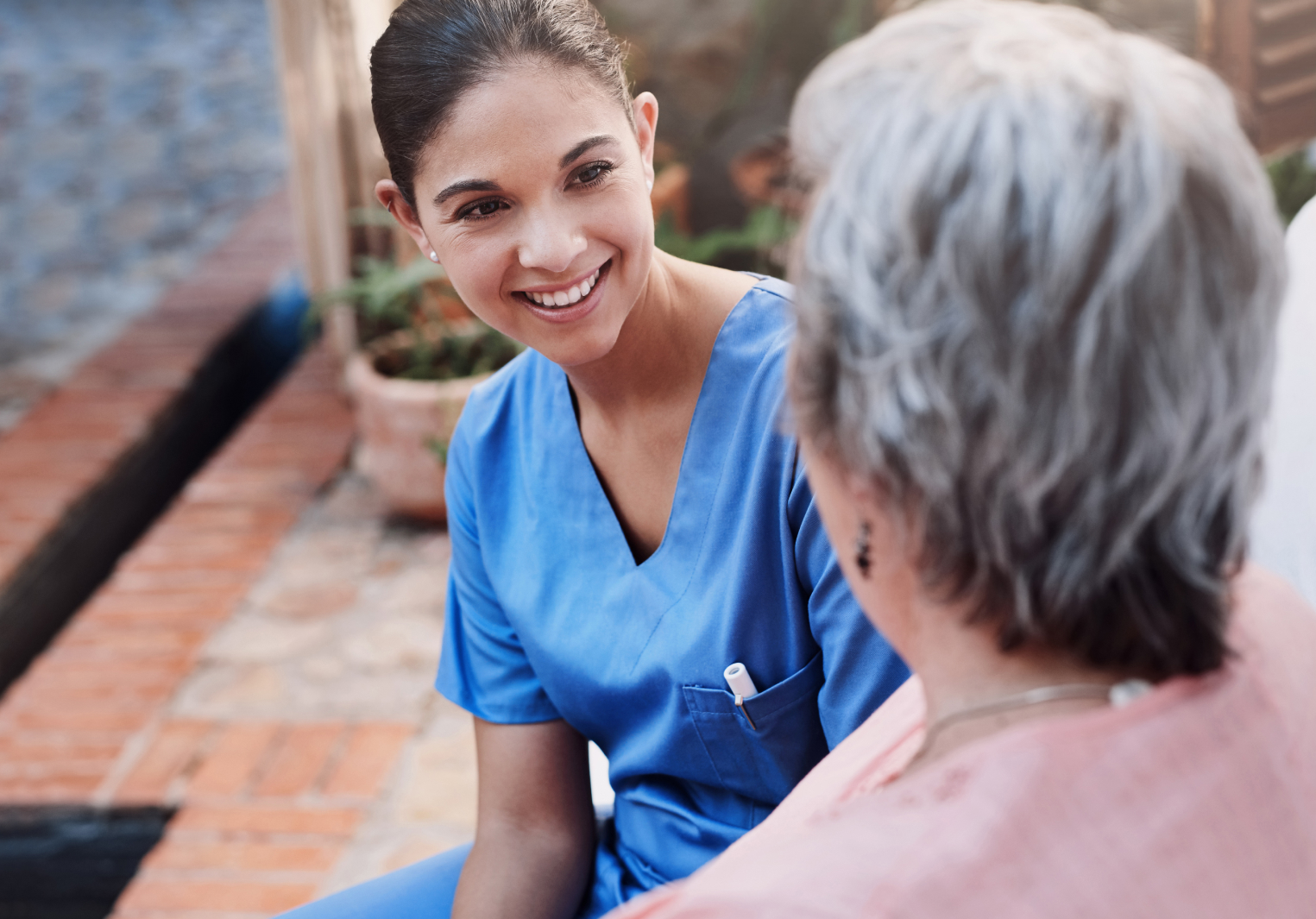 Nurse speaking to elderly lady