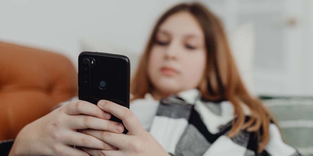 Young girl using mobile phone