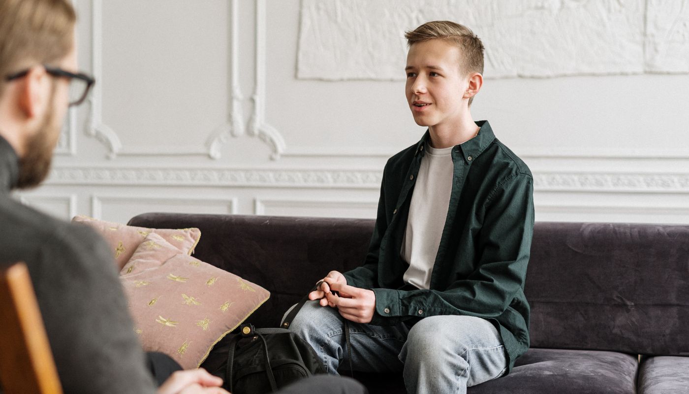 Young man speaks to his psychologist.