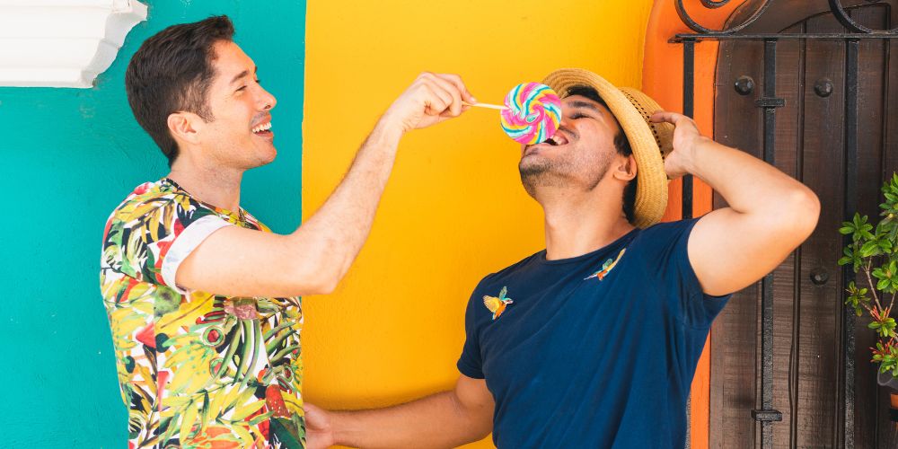 Two people eating lollipops