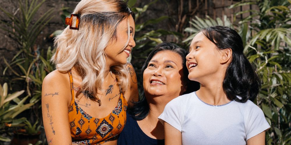 Three generations of women embracing