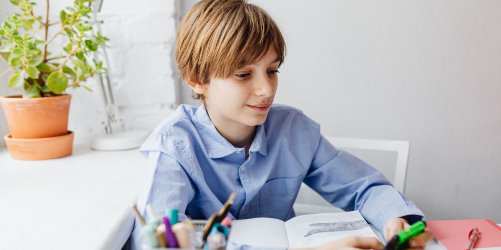 Young boy using his mobile phone