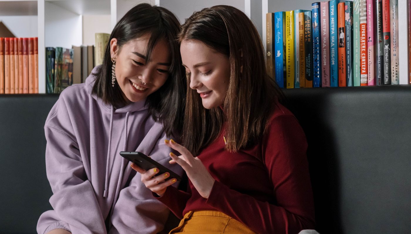 Two teenage girls on their mobile phone.