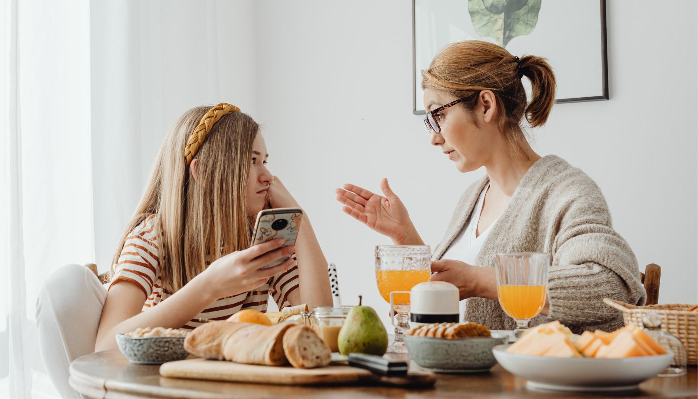 Mother talking to her young daughter.