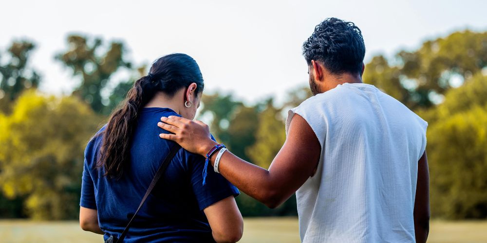 Friend supporting another friend