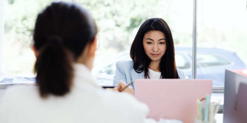 Businesswoman sitting in front of laptop