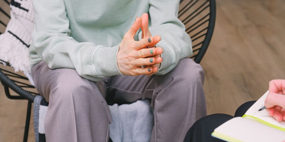 Person sitting in therapy with psychologist