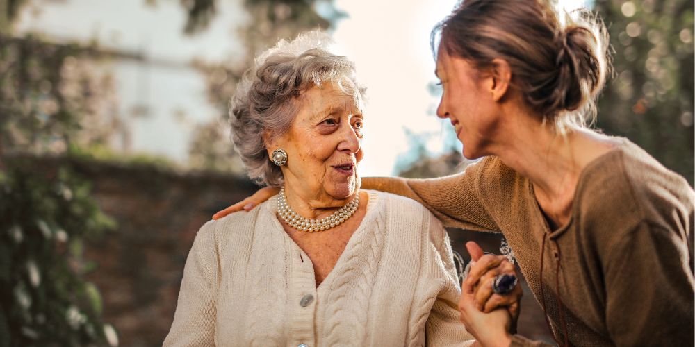 Elderly mother with her adult daughter