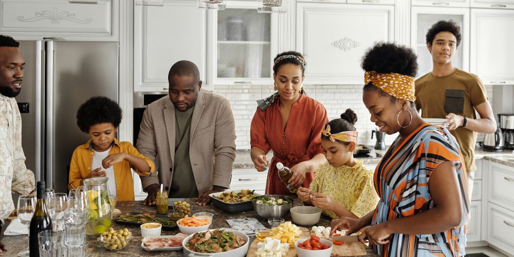 Family in kitchen preparing a meal