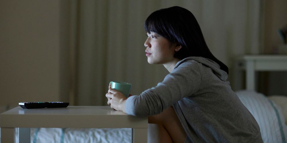 Woman sitting watching TV