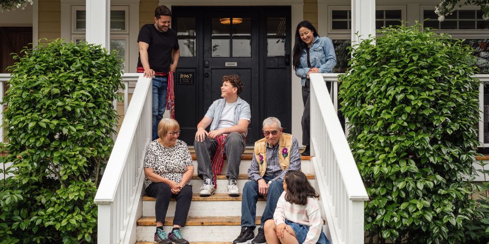 Multiple generations out the front of their home