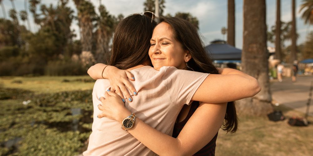 two women embracing in a hug